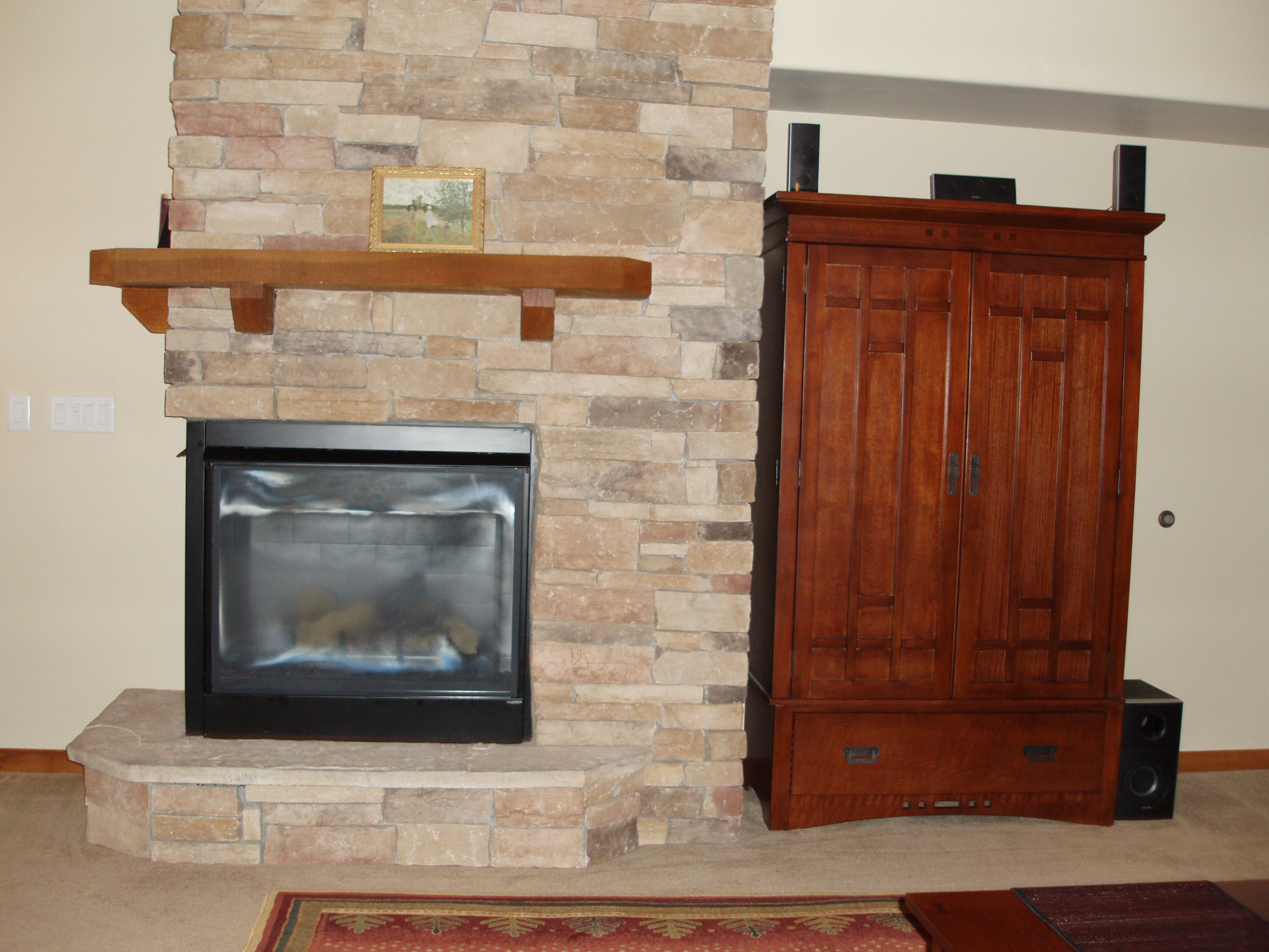 Entertainment Center and Stone Fireplace